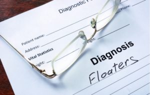 A optometrist's patient form with the word "floaters" written below diagnosis